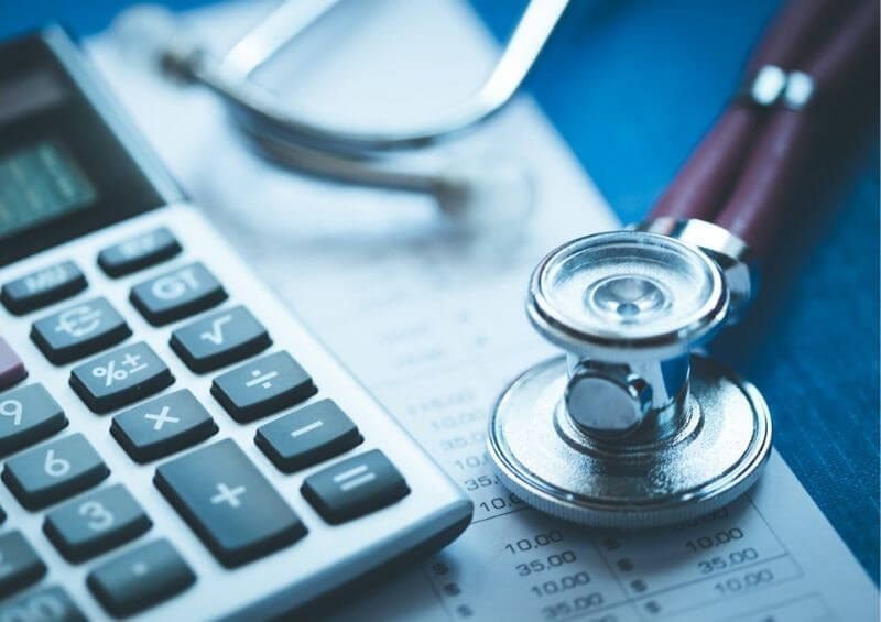 Stethoscope next to calculator