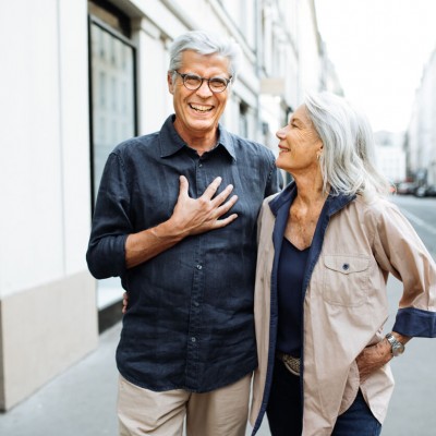 Elderly couple walking in the street