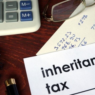 Inheritance tax paperwork next to calculator