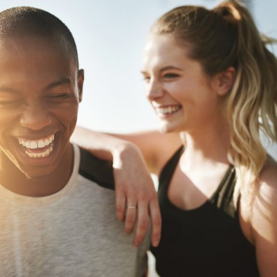 Young couple laughing together outdoors